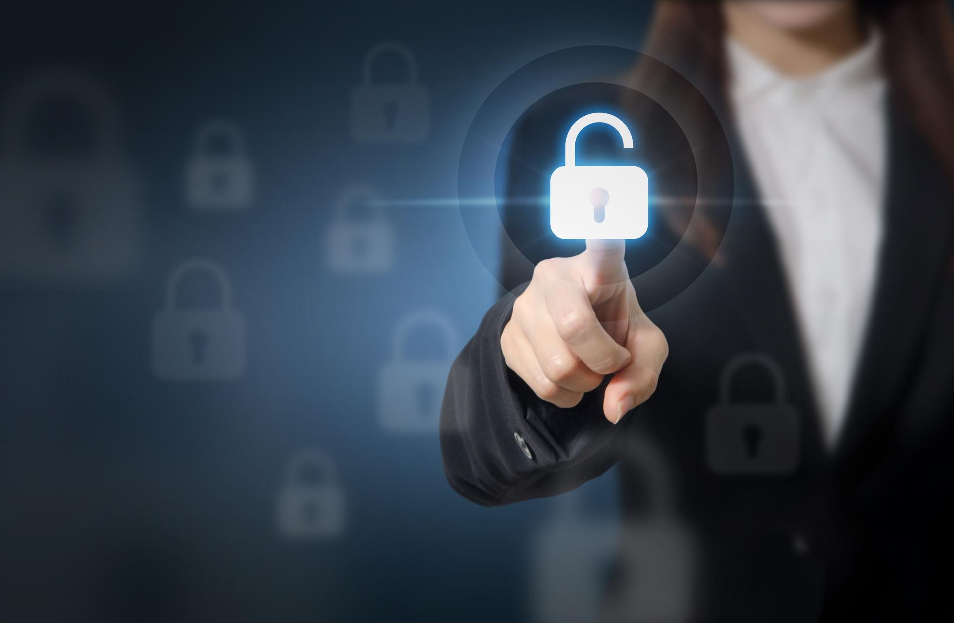 Businesswoman pressing unlocking on virtual screens.